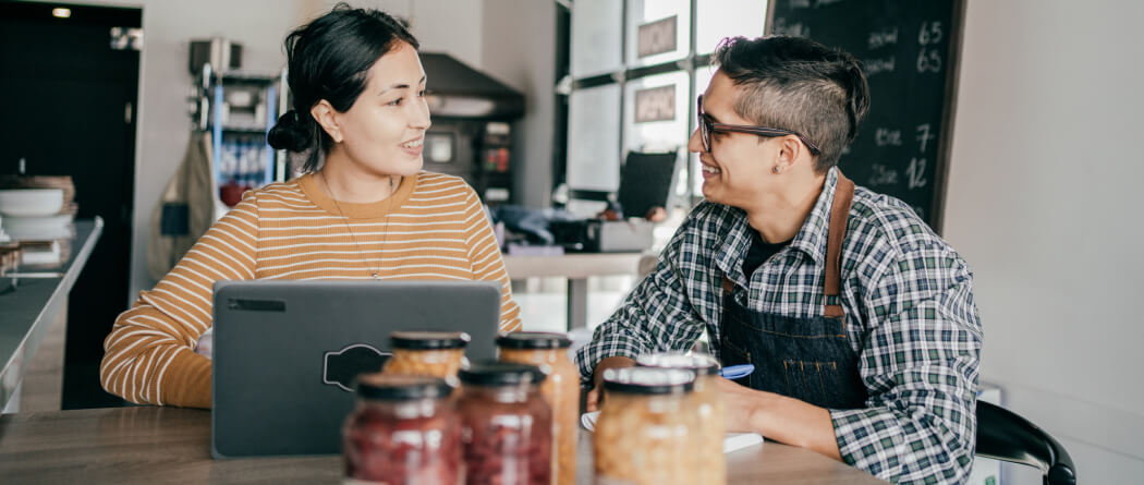 Two workers chatting in a cafe